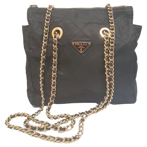 black and gold prada bag|prada black purse.